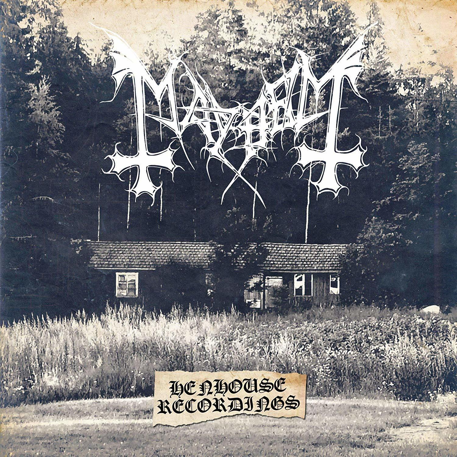 Albumcover: ein Haus in einem Wald mit einem Bandlogo und Text.