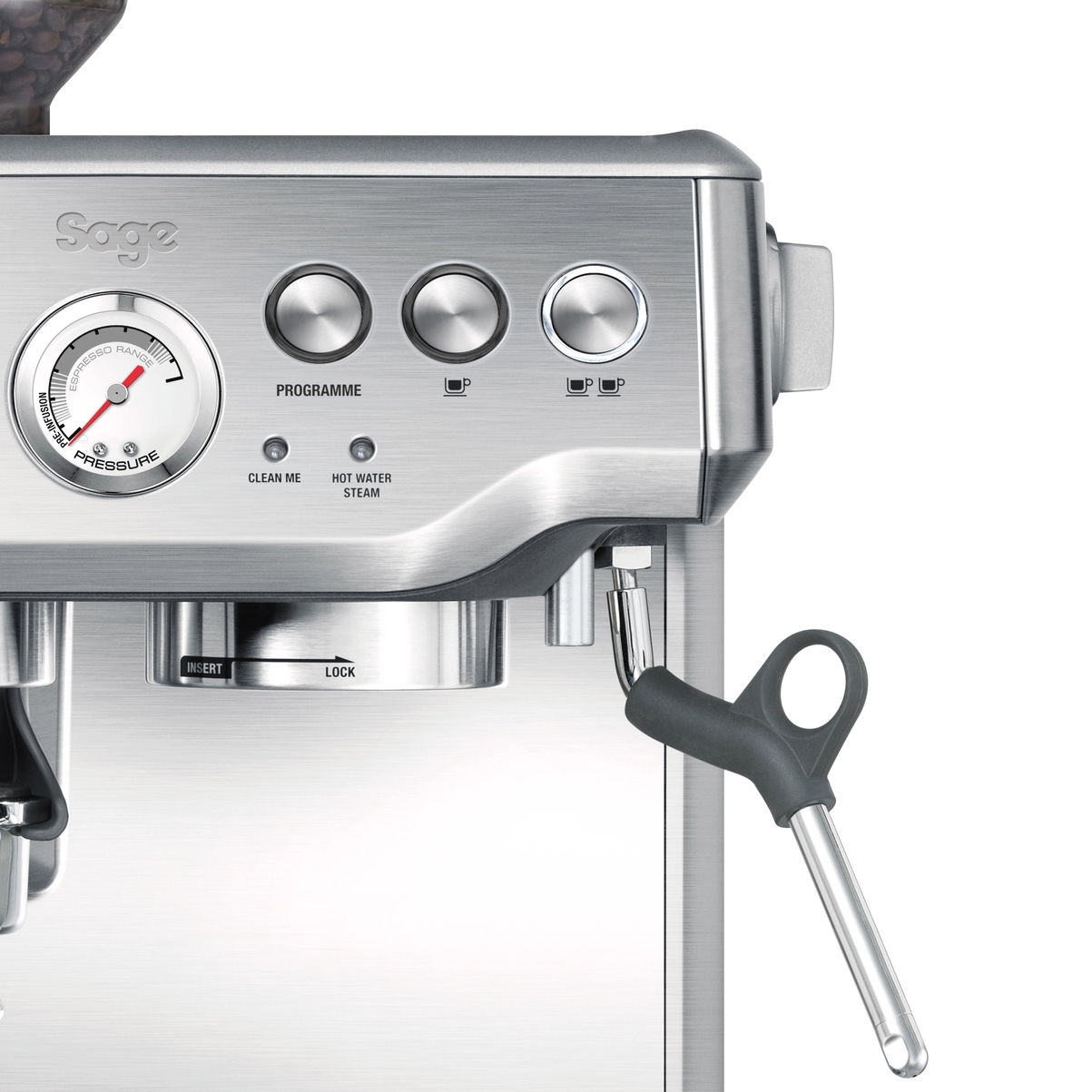 Close-up of a silver espresso machine with dials, buttons and steam wand.