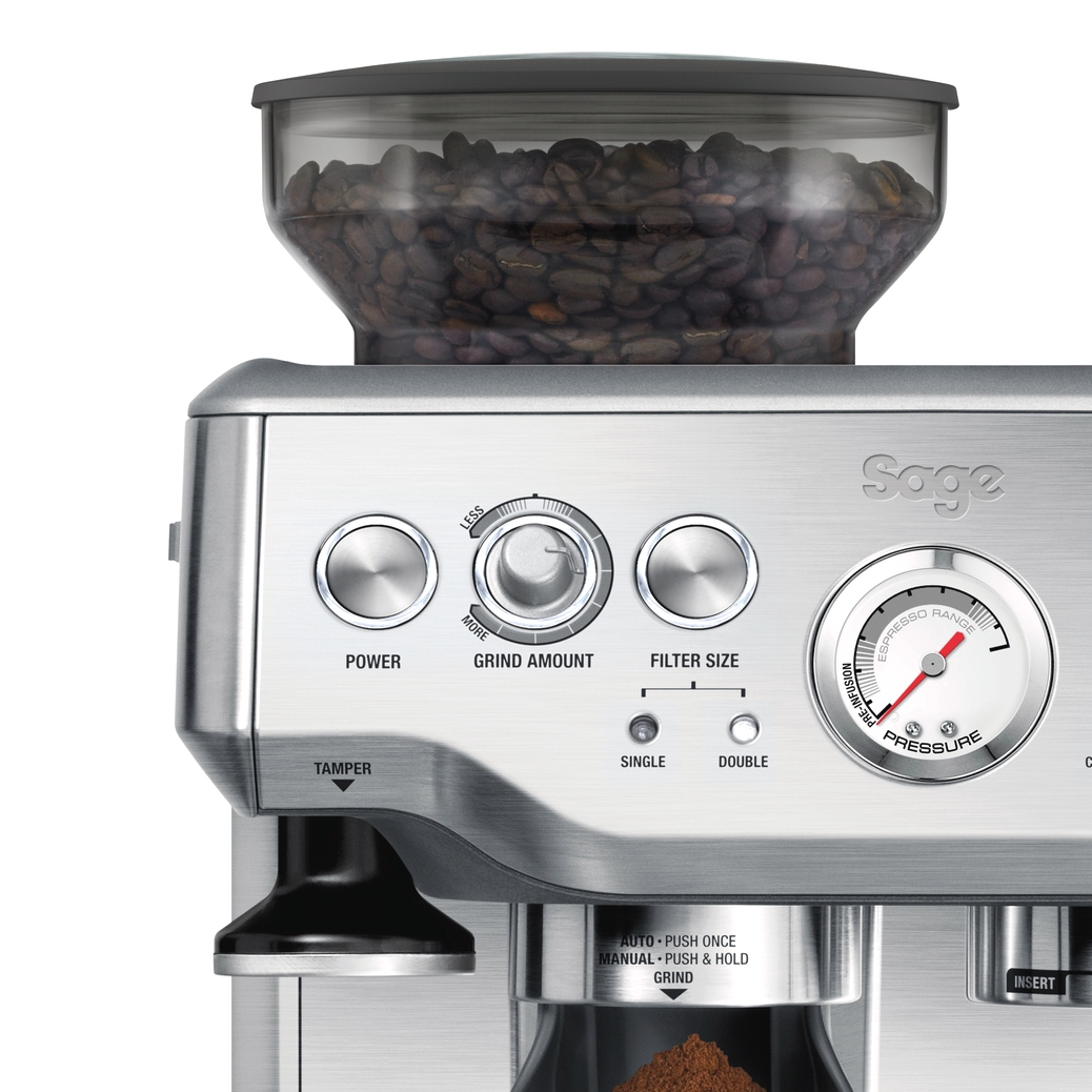 Silver espresso machine with a bean container, grinder, and pressure gauge. Controls visible.