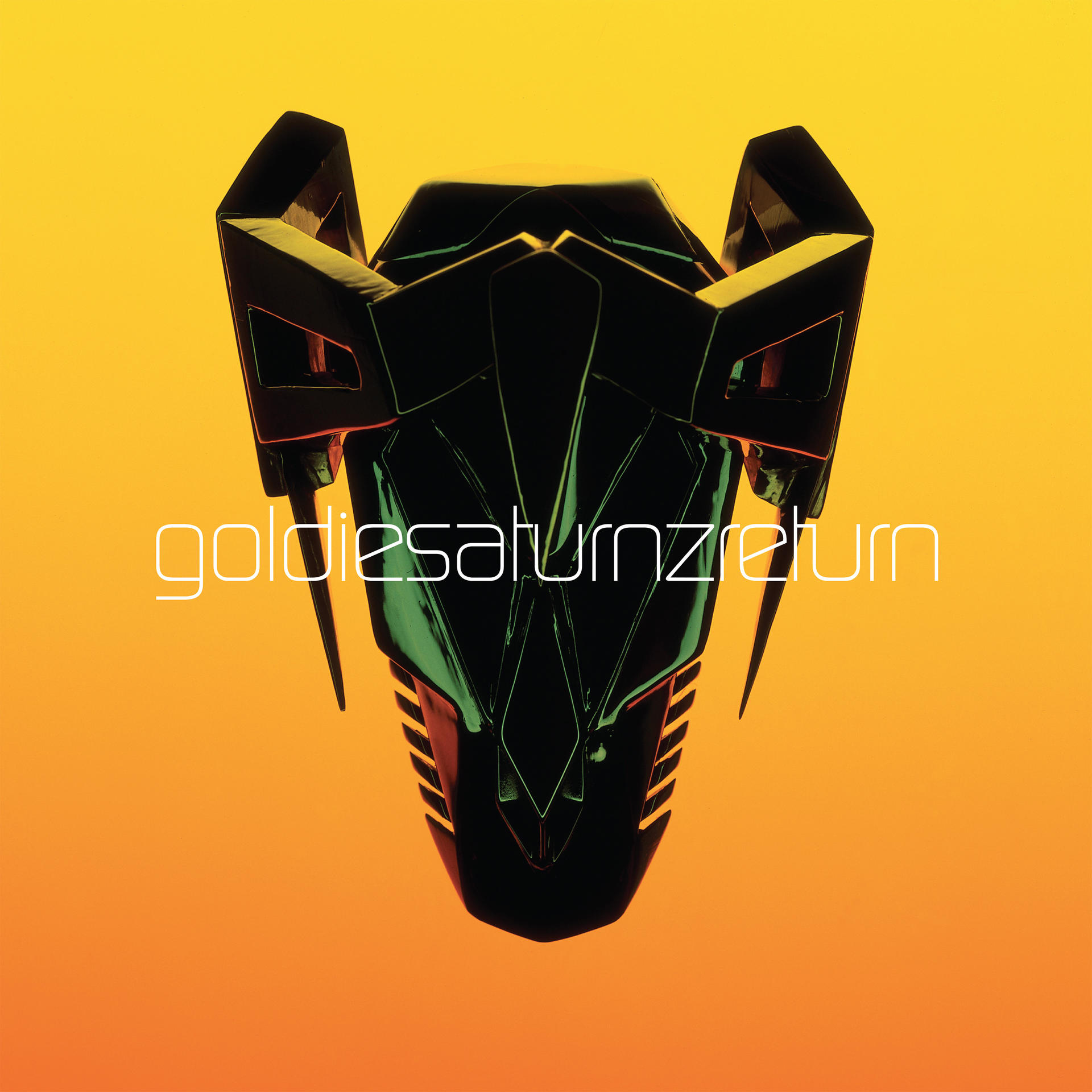 Albumcover: Goldies Saturnzreturn. Eine schwarze, eckige Maske mit orangefarbenem und gelbem Hintergrund.