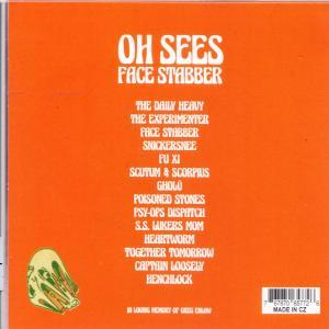 Oranje albumhoes met witte tekst: 'OH SEES FACE STABBER' en tracklist. Een schedelafbeelding linksonder.