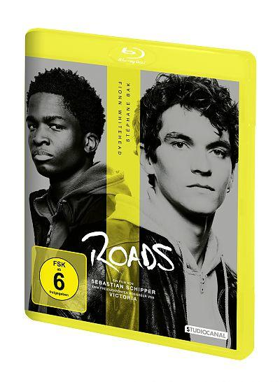 DVD-Hülle mit zwei Männern auf dem Cover, dem Titel Roads und einem gelben Rahmen um die Ränder.