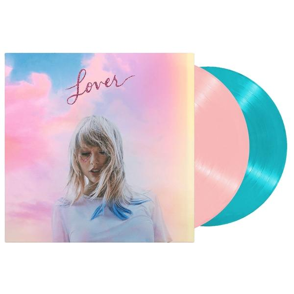 Taylor Swift's albumhoes en twee vinylplaten. Roze en blauwgroene vinyls.