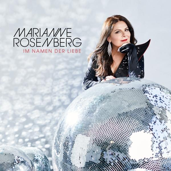 Albumcover mit Frau, Text. Zwei Discokugeln im Vordergrund. Weißer Hintergrund.