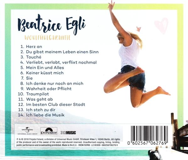 Albumcover mit springender Frau und Titelliste, Text auf Deutsch.