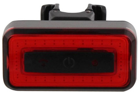 Red bicycle tail light with a black mounting bracket.