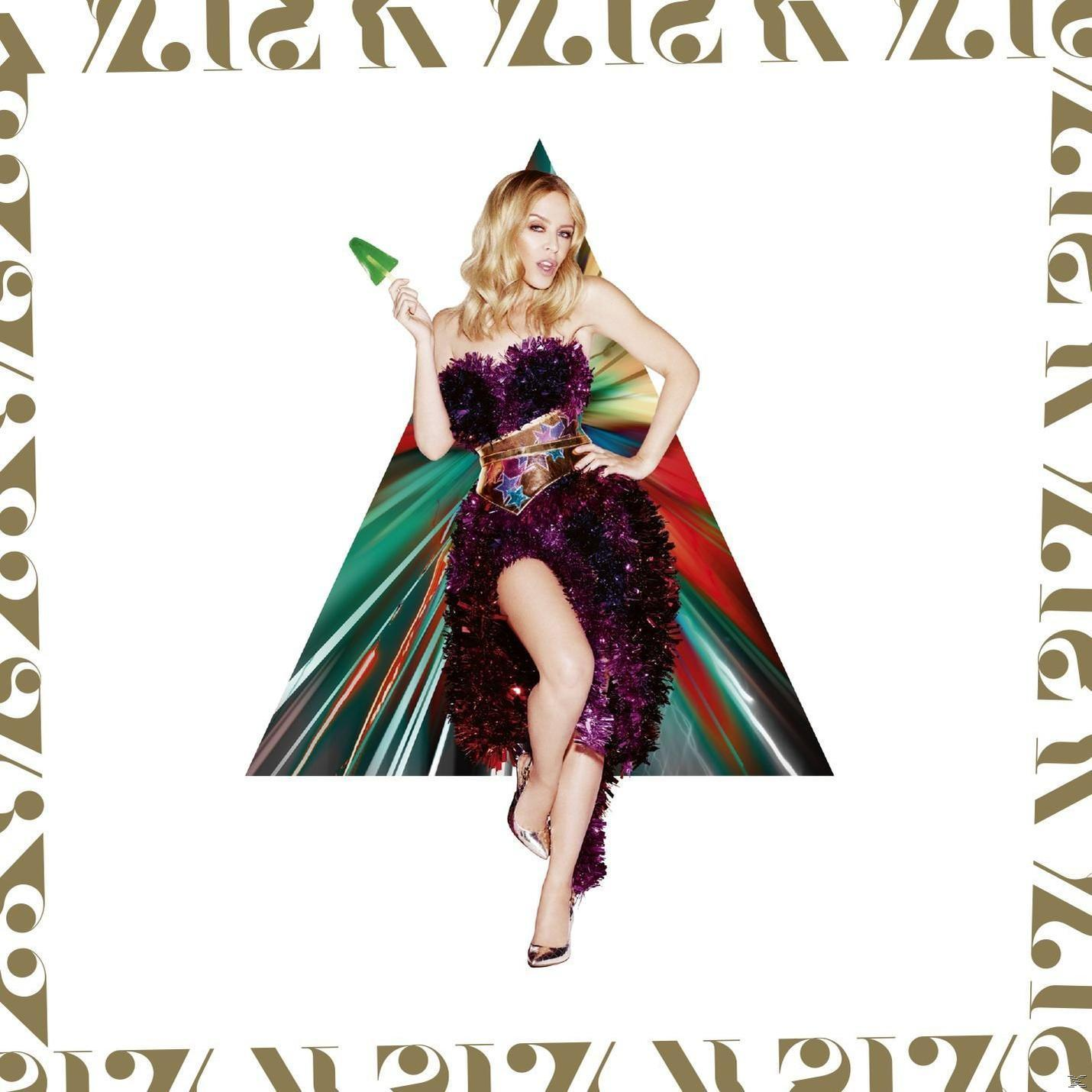 Album borító: Kylie Minogue ünnepi ruhában, zöld kúp tartva, fehér háromszöggel és arany kerettel.
