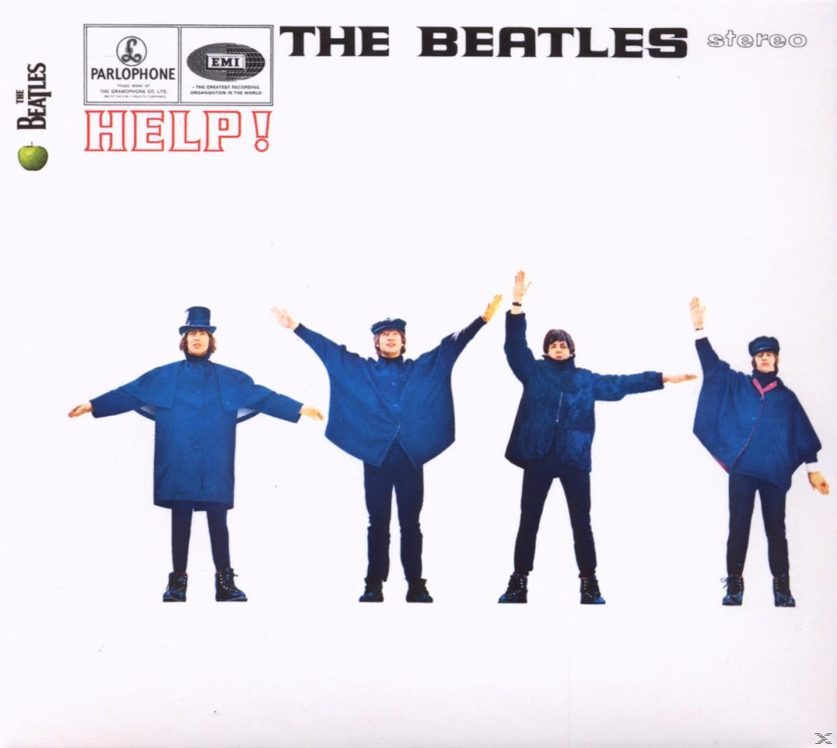 A Beatles album borítója: négy kék kabátos férfi kinyújtott karokkal. Album: Help!