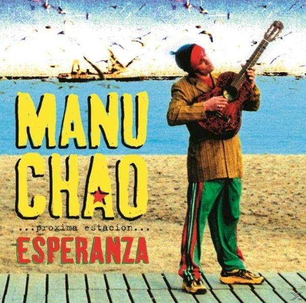 Albumcover: Manu Chao, Mann mit Gitarre am Strand. Gelber Titel, blauer Himmel, sandiger Hintergrund.