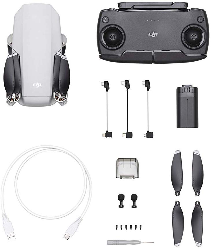 Dron y mando a distancia, con cables de carga, batería, hélices y otros accesorios.