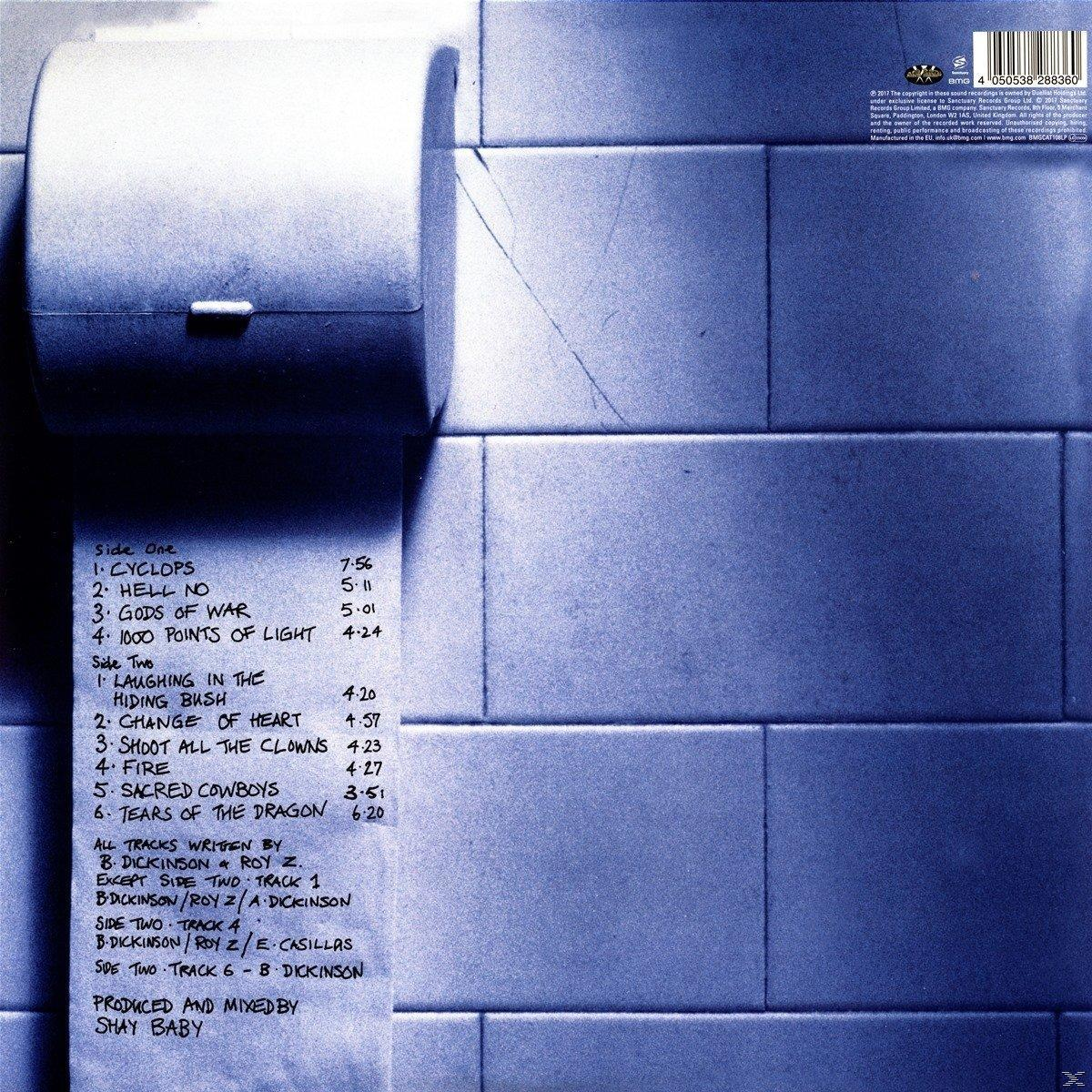 Vinil album, az album borítójának hátulja. Fehér szöveg kék csempézett háttéren. A számok listája és a kreditek láthatók.