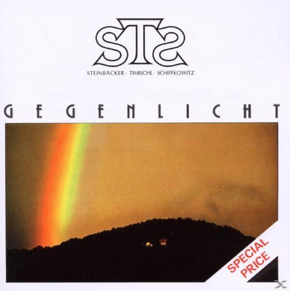 Albumcover mit Regenbogen, Bergsilhouette und dem Text 'Gegenlicht'.
