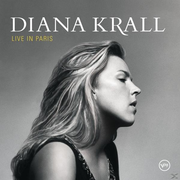 Album borító: Diana Krall, Live in Paris. Nő profilja, szőke haj, fekete felső. Szürke háttér. Fehér szöveg.