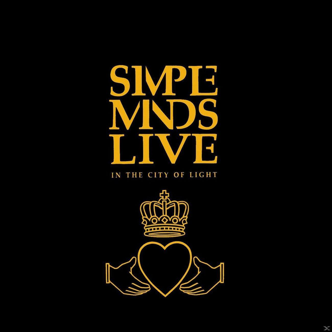 Simple Minds Albumcover. Goldener Schriftzug und Krone auf schwarzem Hintergrund. Hände und Herz.