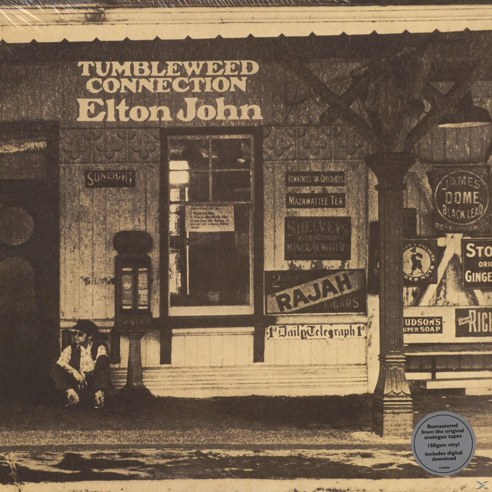 Elton John Tumbleweed Connection szépia tónusú lemezborító egy bolt előtt ülő férfival.