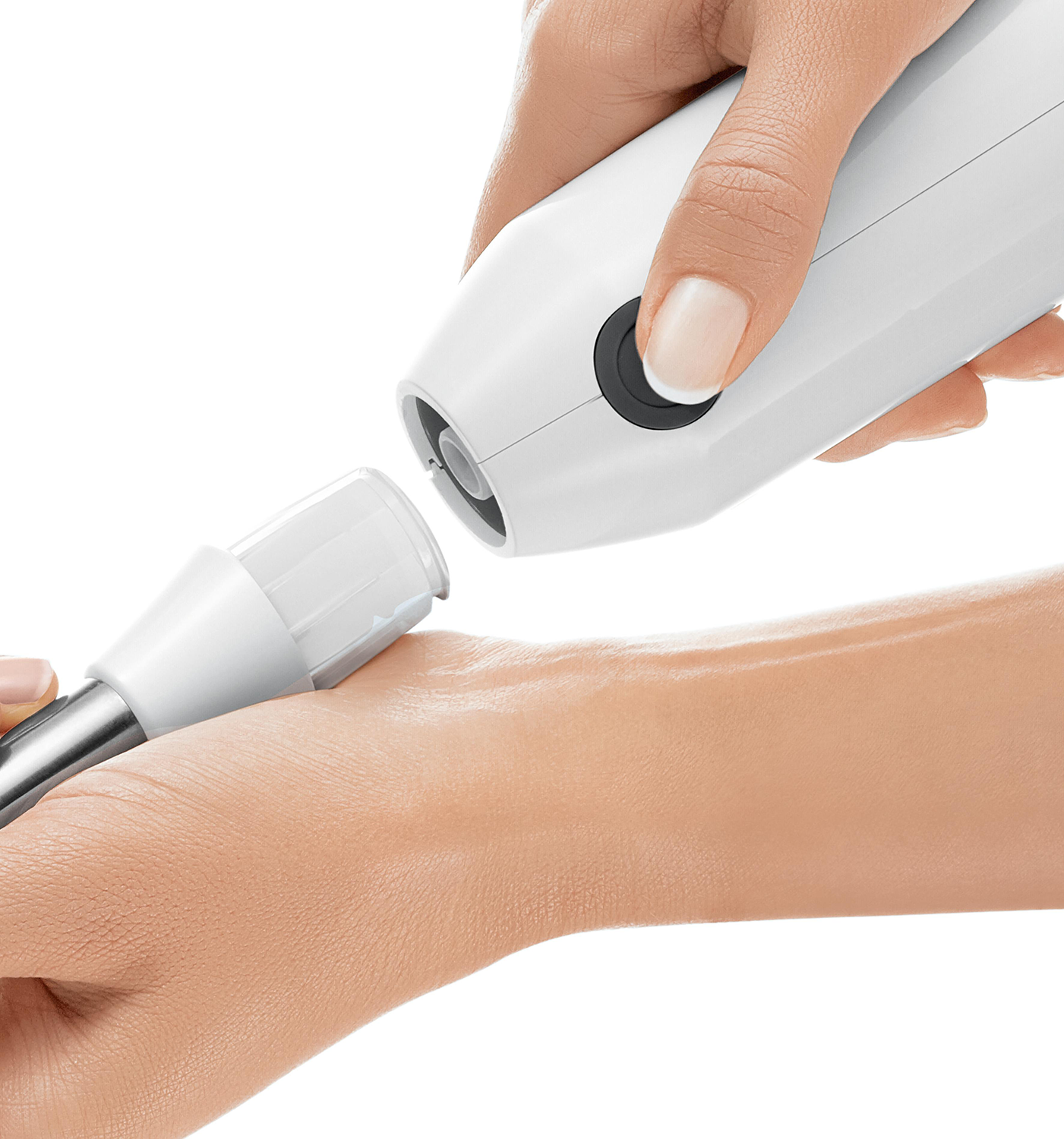 A hand attaching a white blending attachment to a white device.