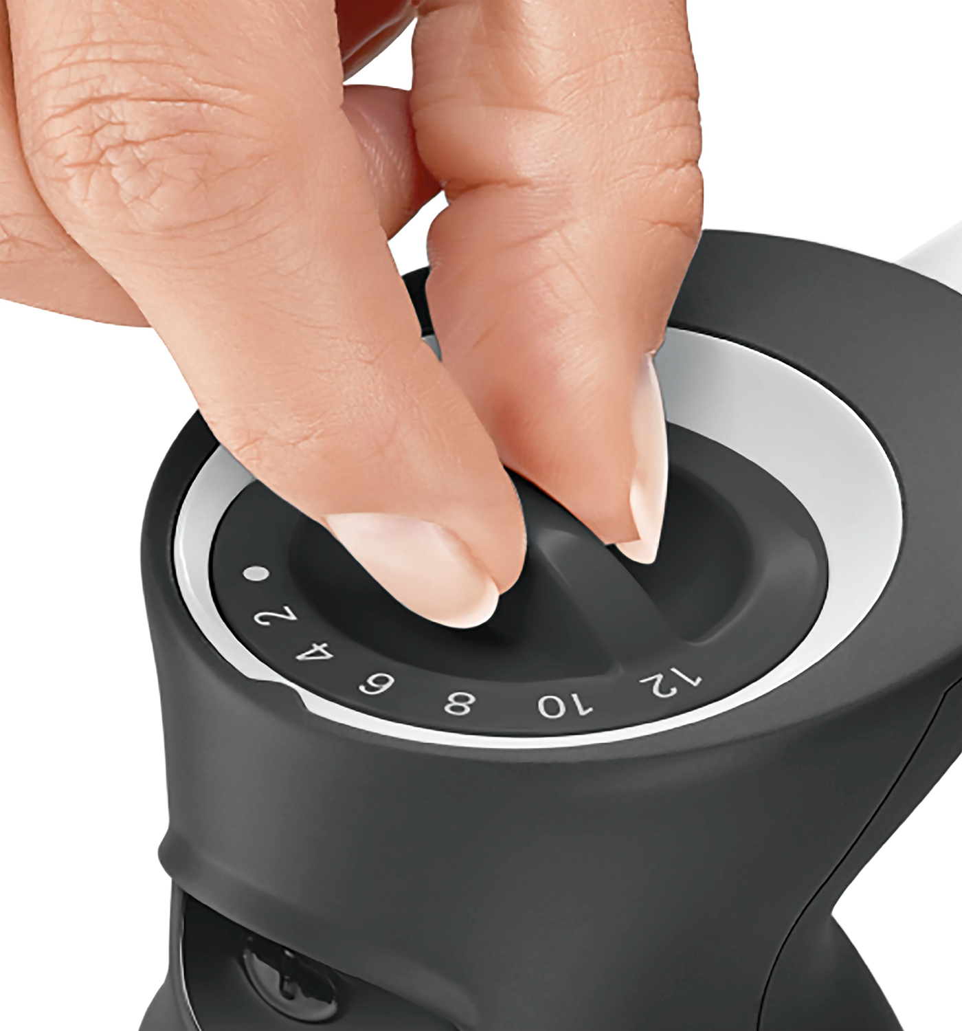 A hand turning a black dial. Numbers 2, 4, 6, 8, 10, and 12 are visible on the dial.
