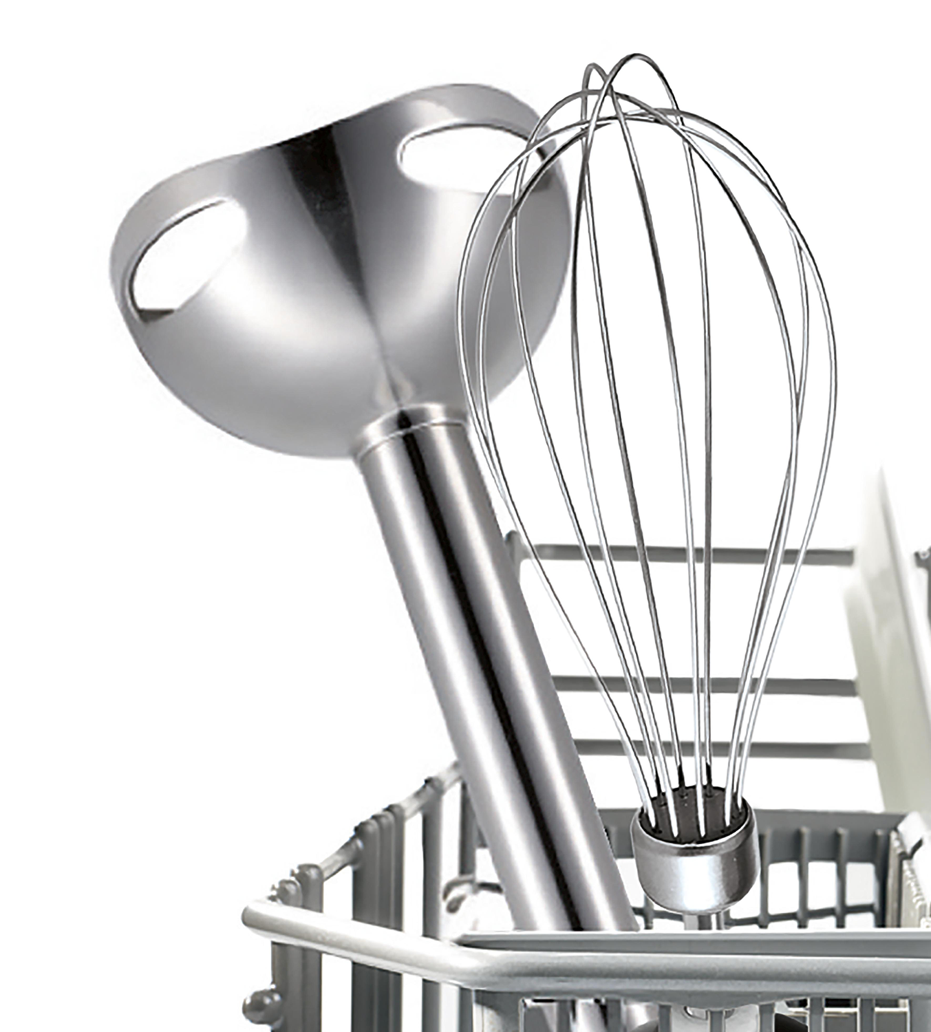 A silver immersion blender with a whisk attachment is in a metal holder.
