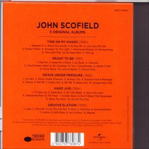 Albumcover, Rückseite, orange. Trackliste und Credits sind auf orangefarbenem Hintergrund mit weißem Text aufgelistet.