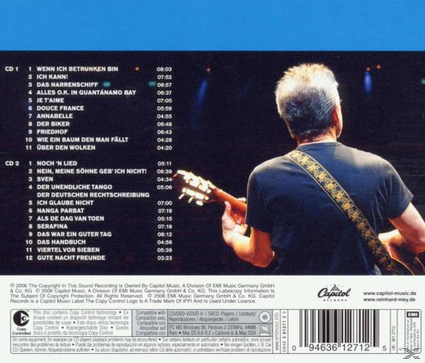 CD-Cover mit Titeln und einem Gitarre spielenden Mann. Der Hintergrund ist dunkelblau mit Bühnenbeleuchtung.