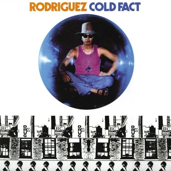 Albumhoes van Rodriguez, 'Cold Fact'. Man met zonnebril in een blauwe bubbel, bakstenen muur eronder.