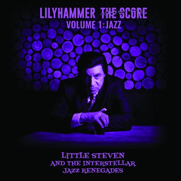 Pochette de CD avec un homme assis à une table, fond violet et titre de l'album.