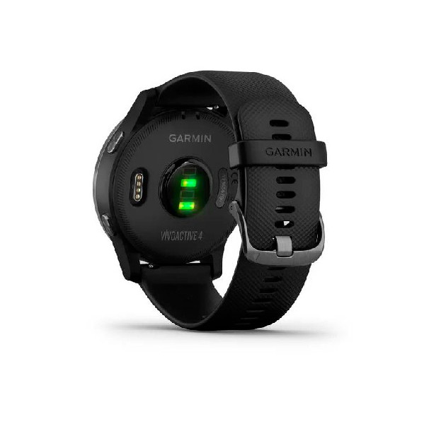 Un reloj Garmin negro, vista trasera, con una correa negra y un sensor de luz verde.