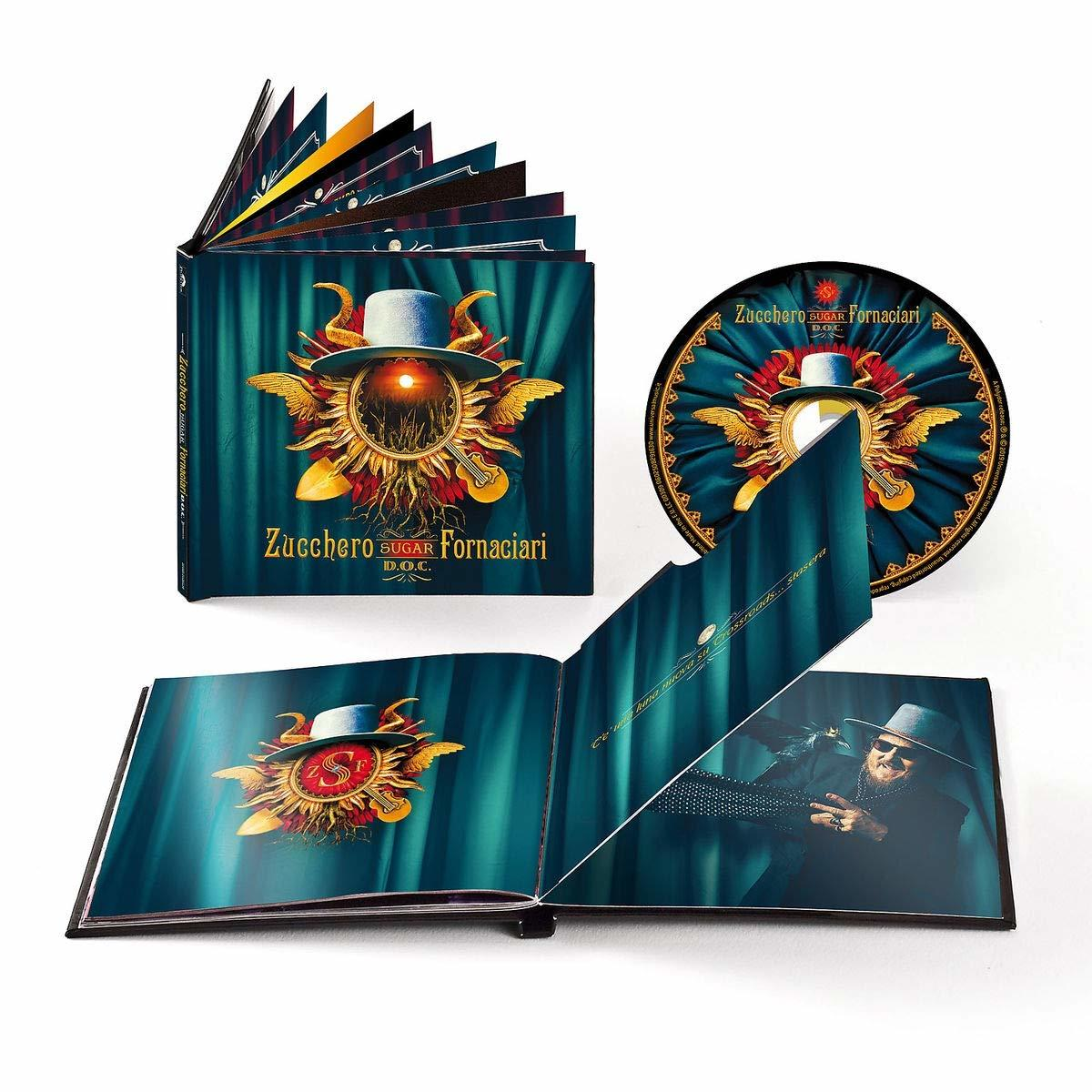 Albumkészlet egy könyvvel és egy CD-vel. A borítón egy szárnyas nap, Zucchero nevével.