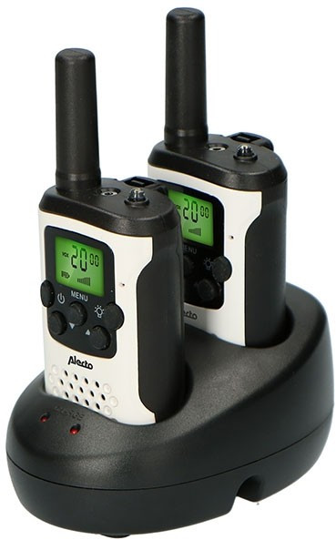 Two black and white walkie-talkies in a black charging base, on a white background.