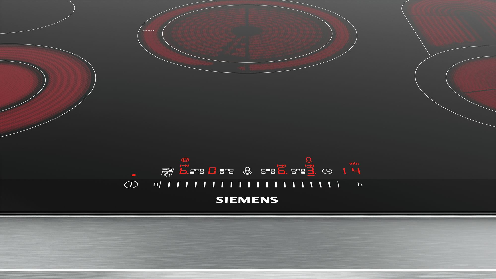 Une plaque à induction noire avec des cercles et un affichage éclairés en rouge.