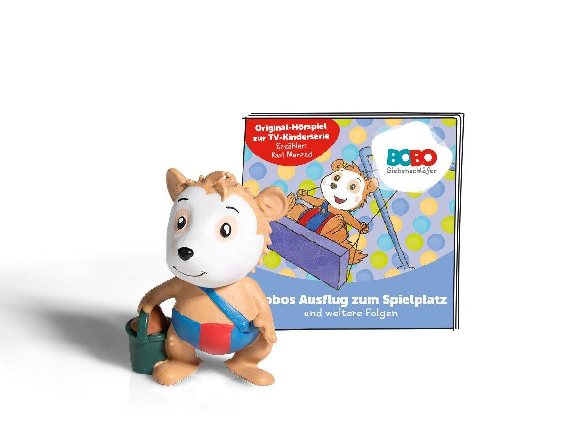 Cartoonfigur eines Bären mit Eimer, mit Buch und buntem Hintergrund.