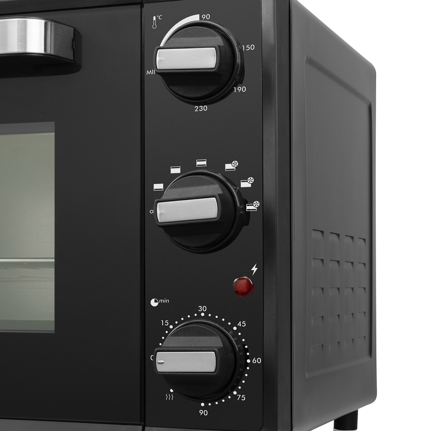 Close-up of an oven control panel with dials and a red power indicator.