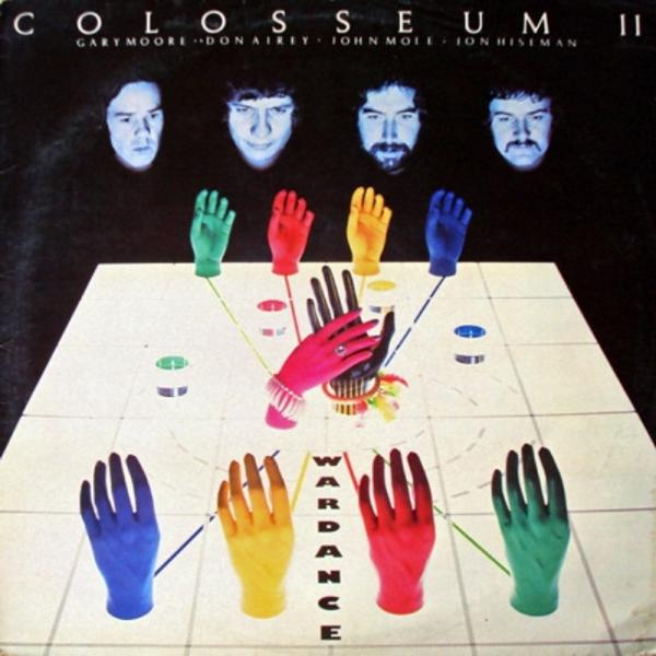 Albumcover mit den Gesichtern der Bandmitglieder oben und farbenfrohen Händen unten. Das Wort "Wardance".