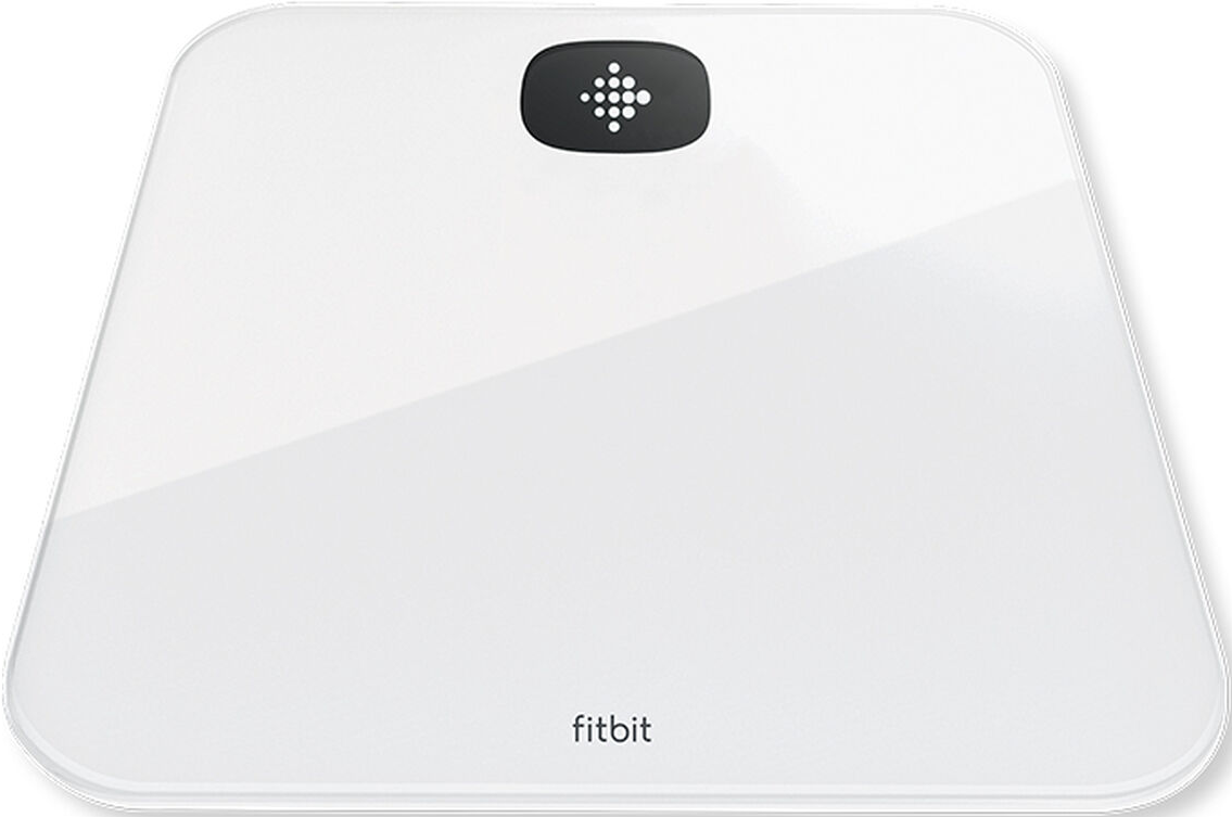 Balance Fitbit blanche. Écran noir avec logo. Design épuré et moderne.