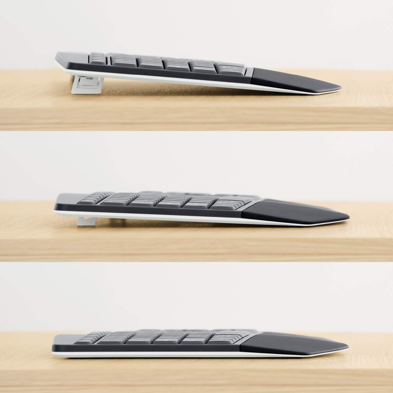 Drei Ansichten einer Tastatur auf einer Holzoberfläche. Es ist eine grau-schwarze Tastatur.