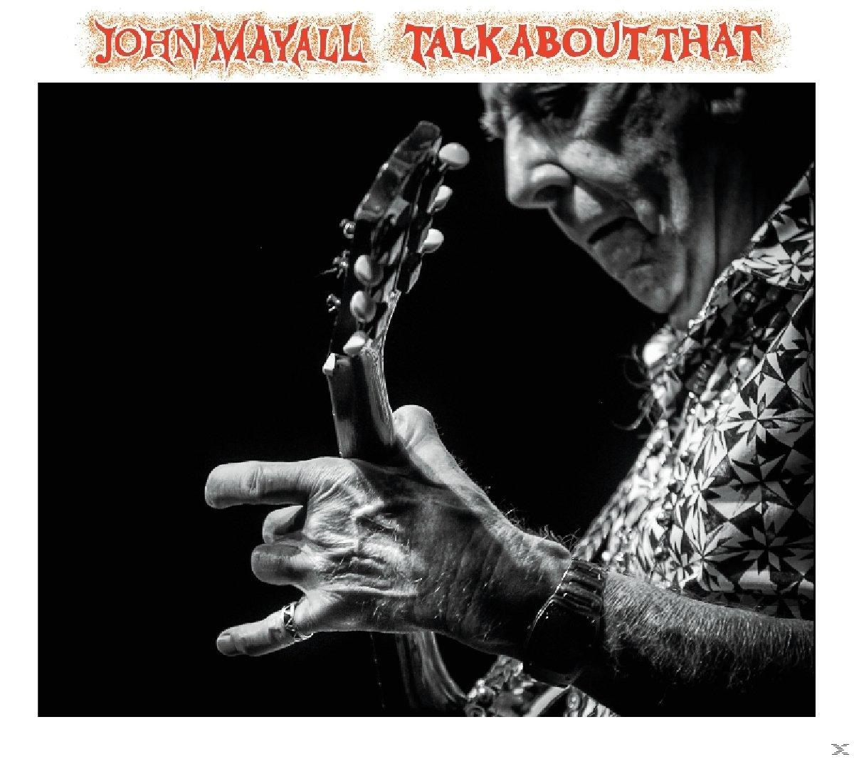 John Mayall gitározik, fekete-fehér kép, a hangsúly a kezén és a gitáron van.