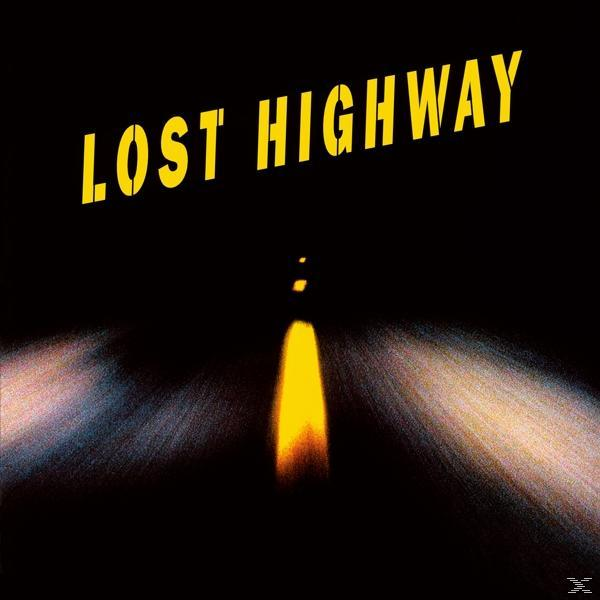Album borító. Egy sárga „LOST HIGHWAY” fekete háttéren. Fényszórók világítanak egy sötét úton.