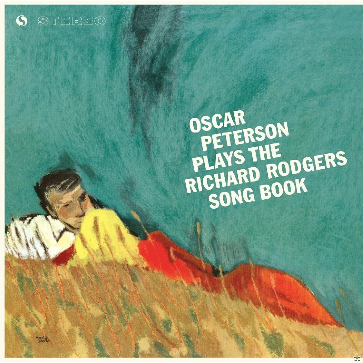 Album borító egy férfival a fűben fekve, absztrakt háttérrel. Cím: Oscar Peterson játszik...