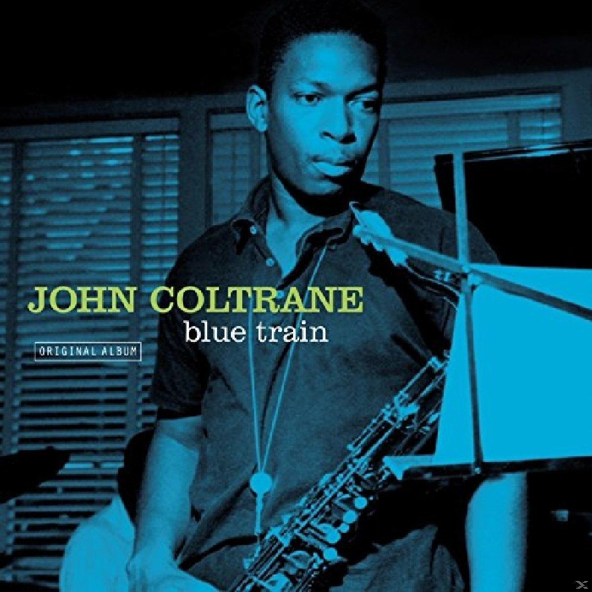 John Coltrane 'Blue Train' című albumának borítója. Egy embert ábrázol szaxofonnal.