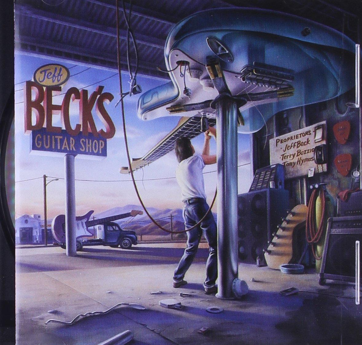 Album borító. Egy férfi egy nagyméretű gitáron dolgozik egy gitárboltban.