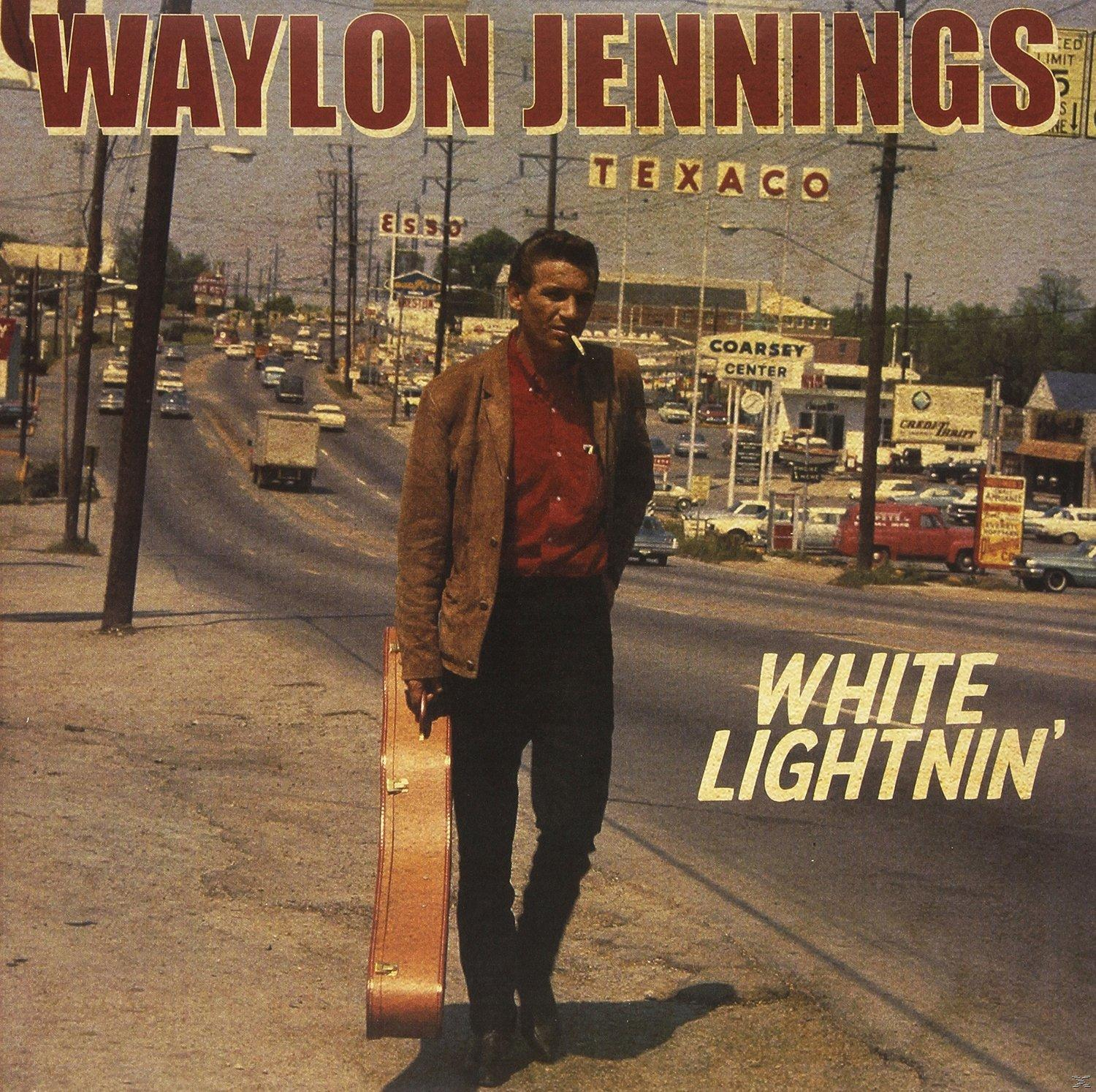 Albumcover: Waylon Jennings, Mann mit Gitarrenkoffer, geht auf der Straße.