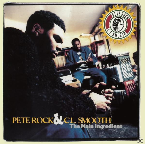 Albumcover von Pete Rock & C.L. Smooth, zwei Männer, einer hält ein Mikrofon. Der Hintergrund ist ein Raum mit Kisten.