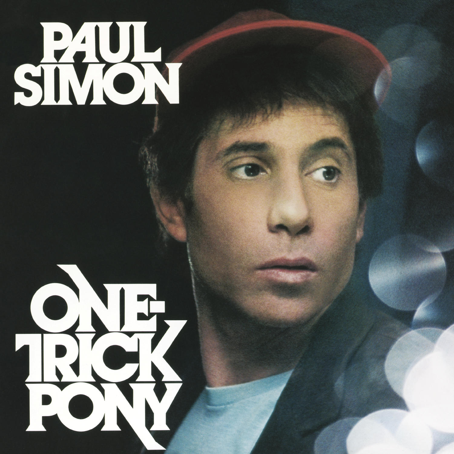 Paul Simon album borítója, One Trick Pony felirattal és piros sapkával.