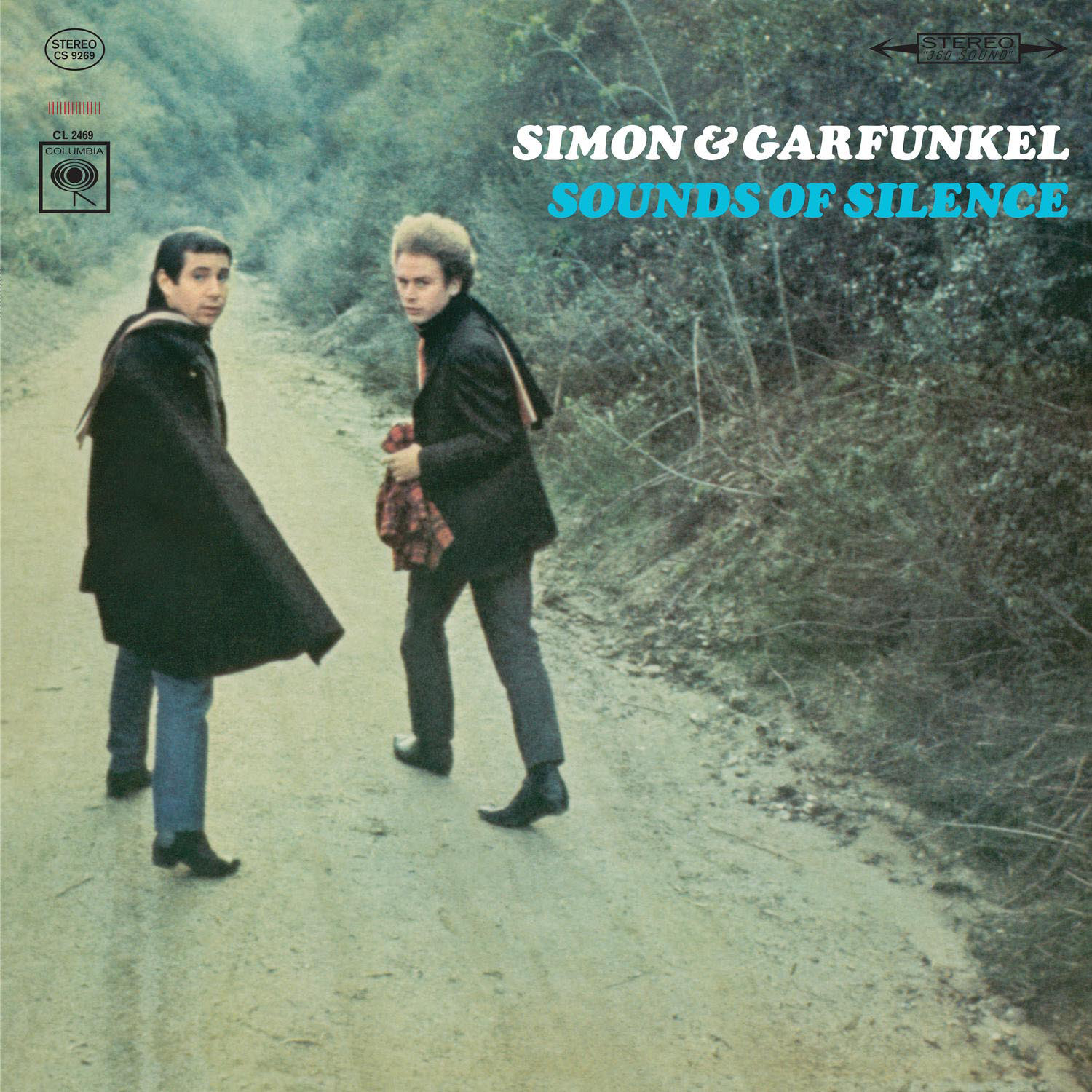 Albumcover: Zwei Männer gehen auf einem Pfad. Grüner Hintergrund mit Bäumen und blauem Himmel.
