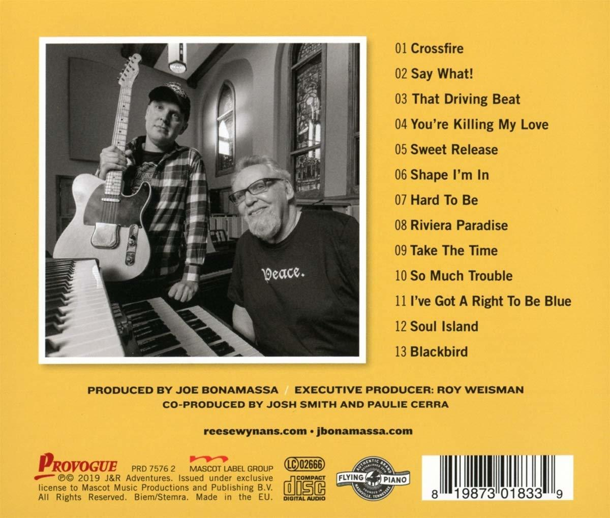 Album borító két férfival, egy zongorával és számlistával.