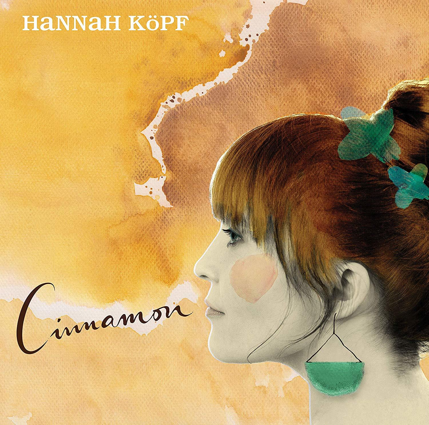 Albumcover mit Profil einer Frau vor gelb-braunem Hintergrund. Das Wort 'Cinnamon' ist geschrieben.
