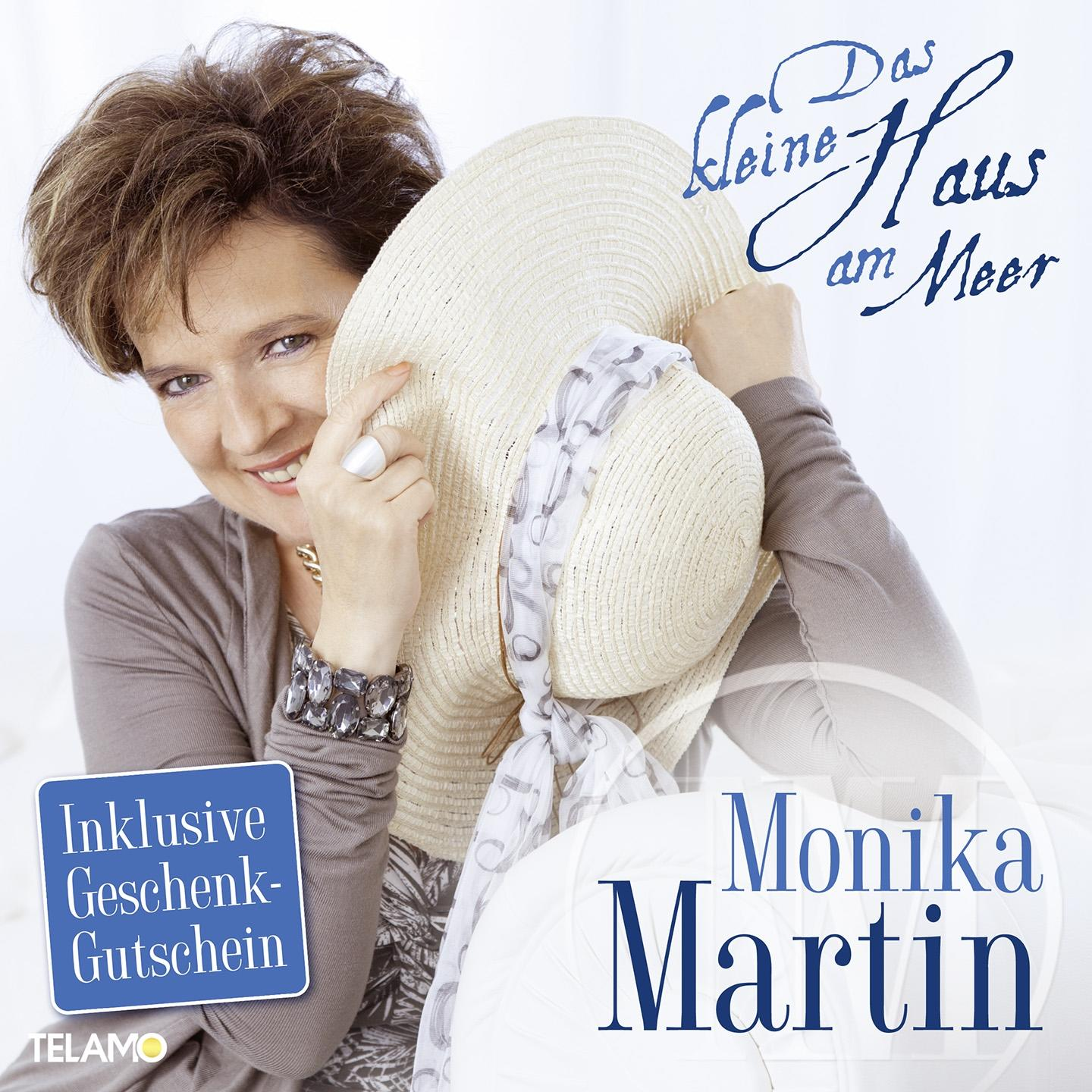 Monika Martin Albumcover mit einer Frau, die einen Sonnenhut hält.