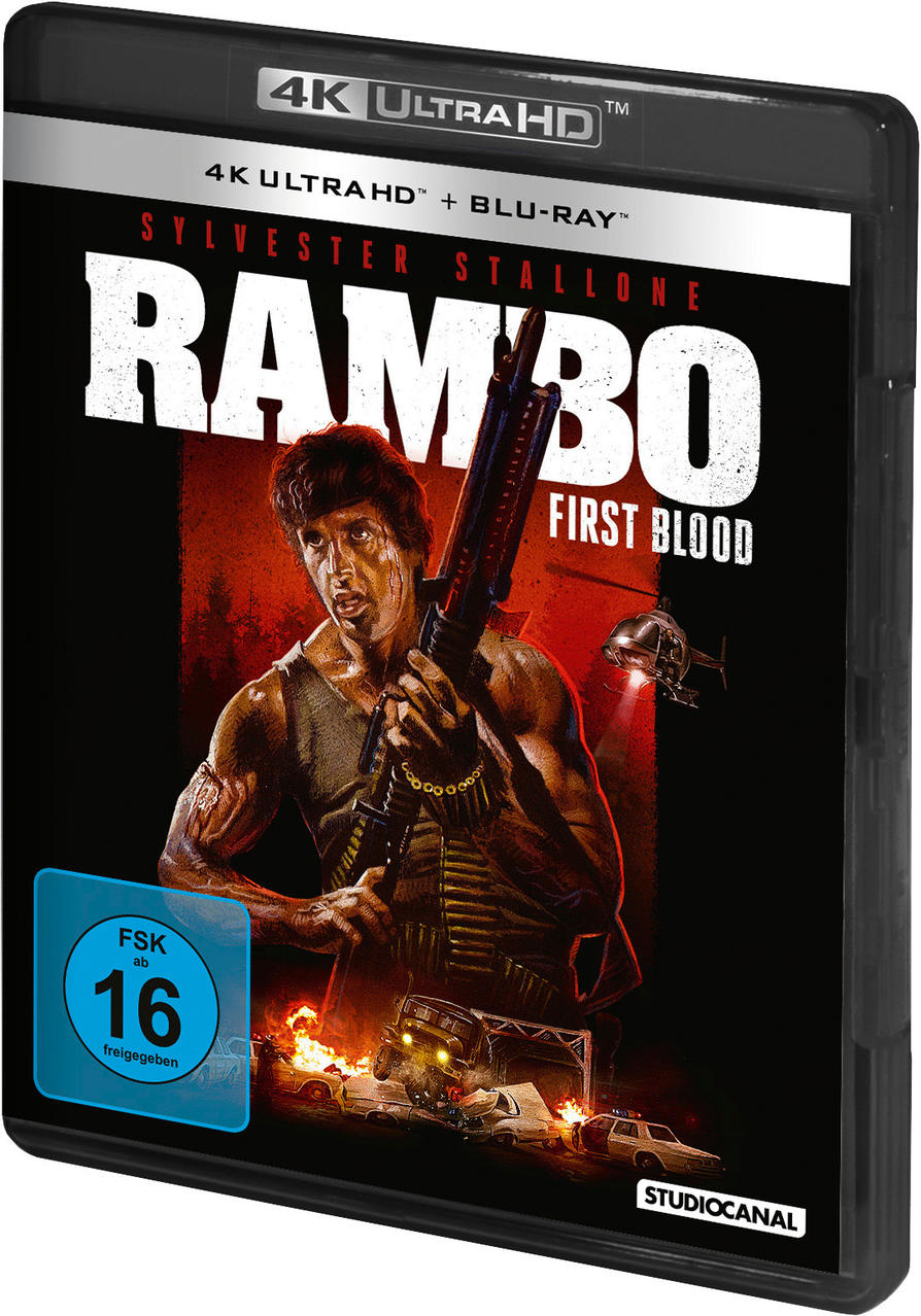 Rambo-Filmcover mit Sylvester Stallone, der eine Waffe hält. Hubschrauber und Explosionen im Hintergrund.