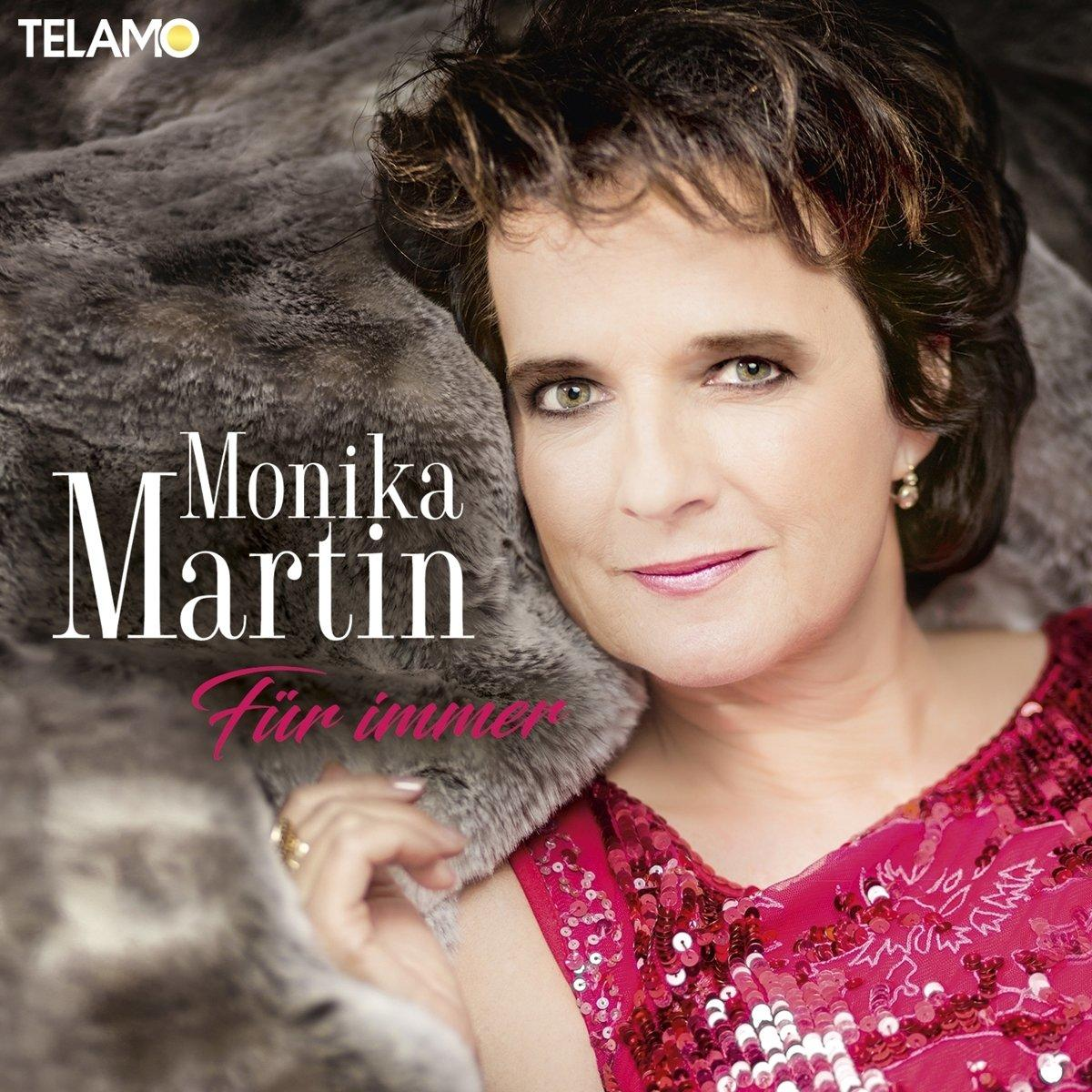 Monika Martin Albumcover. Frau in rotem Kleid, auf Pelz liegend.