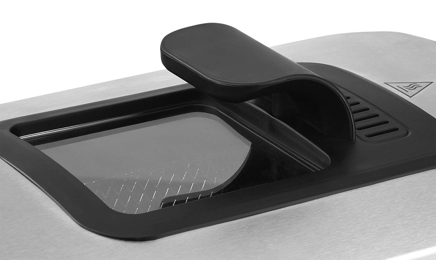 Close-up of a deep fryer lid. Black handle, glass window, and stainless steel surface. Warning symbol on the right.